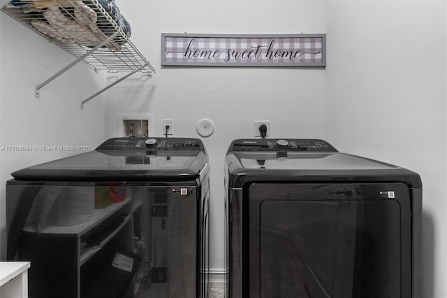clothes washing area with laundry area and washing machine and clothes dryer