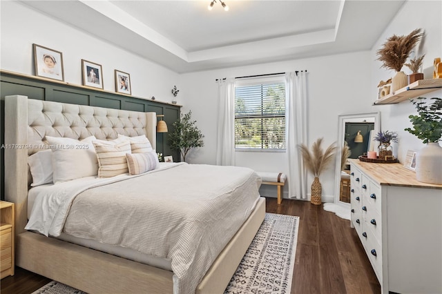 4859 NW 55th Pl, Tamarac, FL 33319 - bedroom with a tray ceiling and dark wood-style floors