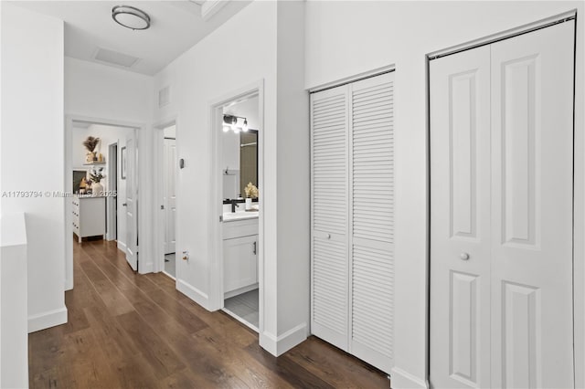 4859 NW 55th Pl, Tamarac, FL 33319 - hall featuring dark wood-type flooring and baseboards
