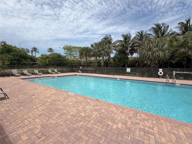 4859 NW 55th Pl, Tamarac, FL 33319 - community pool featuring fence and a patio area