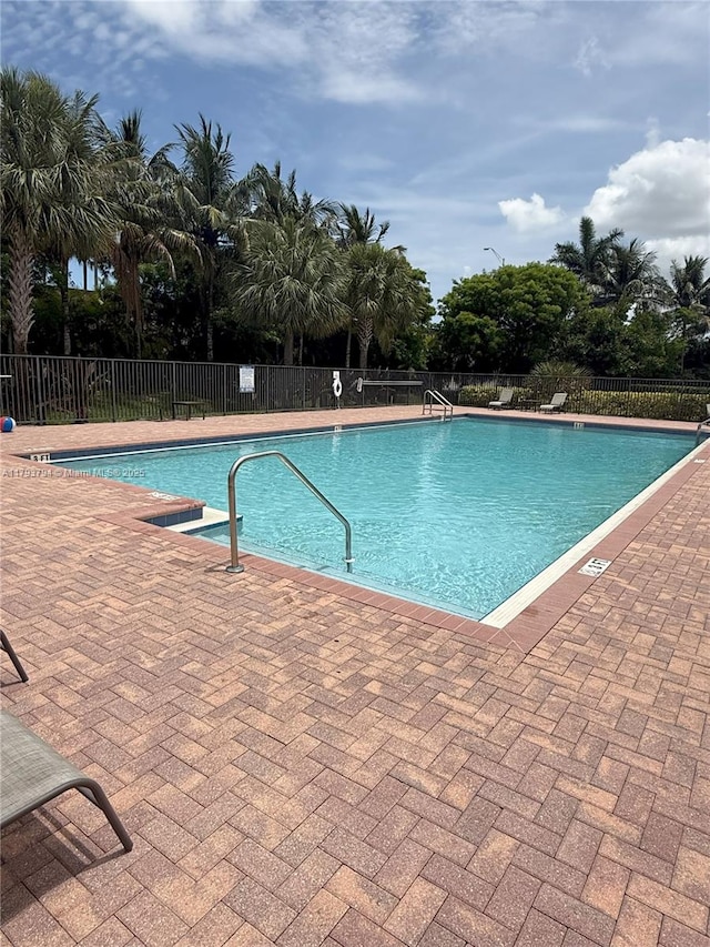 4859 NW 55th Pl, Tamarac, FL 33319 - community pool with fence and a patio