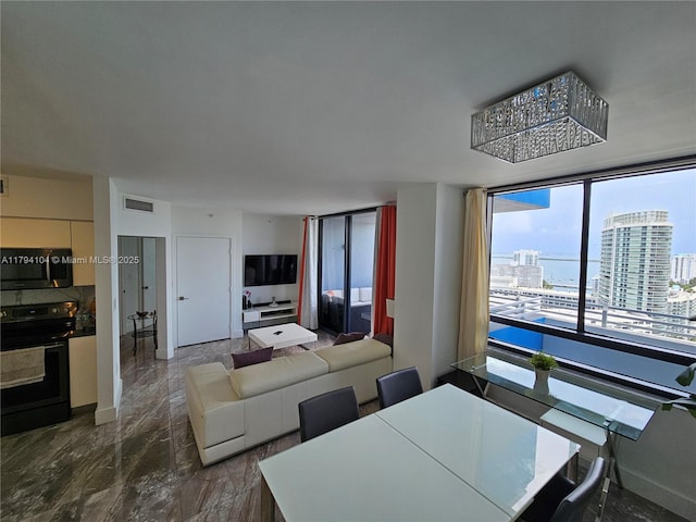 dining room with visible vents and marble finish floor