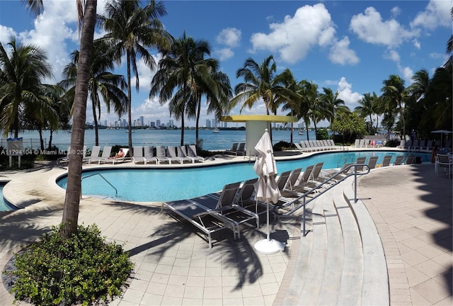 community pool with a patio area