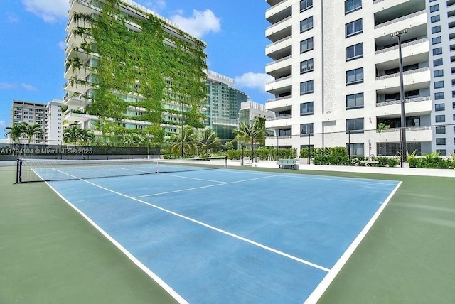 view of tennis court with fence