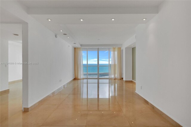 17875 Collins Ave Unit 905, Sunny Isles Beach, FL 33160 - unfurnished room featuring a water view, baseboards, recessed lighting, and expansive windows