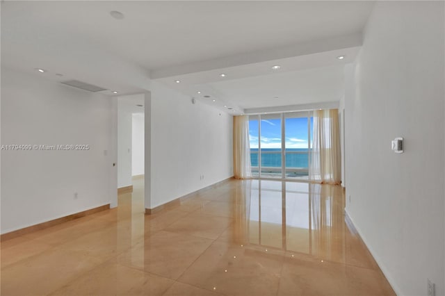 17875 Collins Ave Unit 905, Sunny Isles Beach, FL 33160 - empty room with baseboards, recessed lighting, a water view, expansive windows, and light tile patterned floors