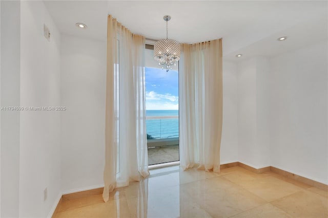 17875 Collins Ave Unit 905, Sunny Isles Beach, FL 33160 - spare room featuring recessed lighting, baseboards, and a chandelier