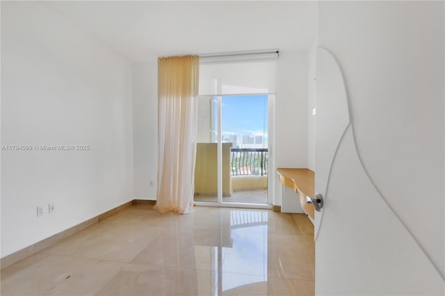 17875 Collins Ave Unit 905, Sunny Isles Beach, FL 33160 - unfurnished room featuring baseboards and a wall of windows