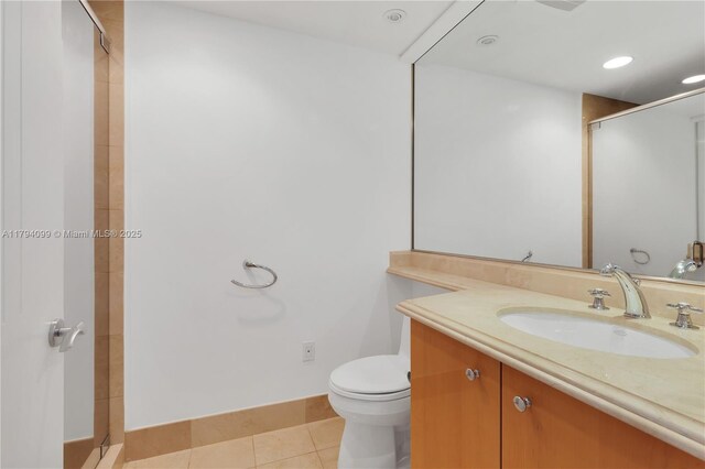 17875 Collins Ave Unit 905, Sunny Isles Beach, FL 33160 - full bathroom with vanity, toilet, tile patterned floors, baseboards, and a stall shower