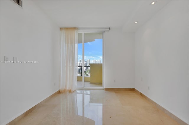 17875 Collins Ave Unit 905, Sunny Isles Beach, FL 33160 - empty room with visible vents, recessed lighting, baseboards, light tile patterned floors, and floor to ceiling windows