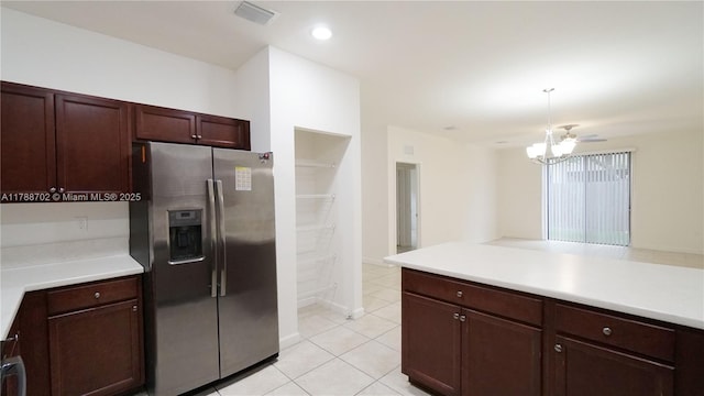 kitchen with light countertops, stainless steel refrigerator with ice dispenser, and visible vents