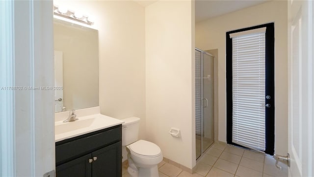 full bath with toilet, a shower stall, tile patterned flooring, and vanity