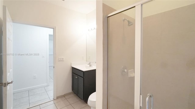 full bath with toilet, tile patterned floors, a shower stall, and vanity