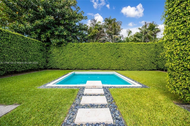 view of pool featuring a lawn, a fenced in pool, and a fenced backyard