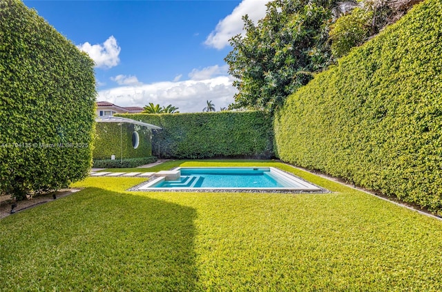 view of swimming pool featuring a lawn, a fenced in pool, and a fenced backyard