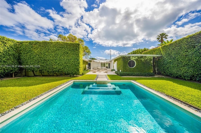view of swimming pool with a yard and a patio