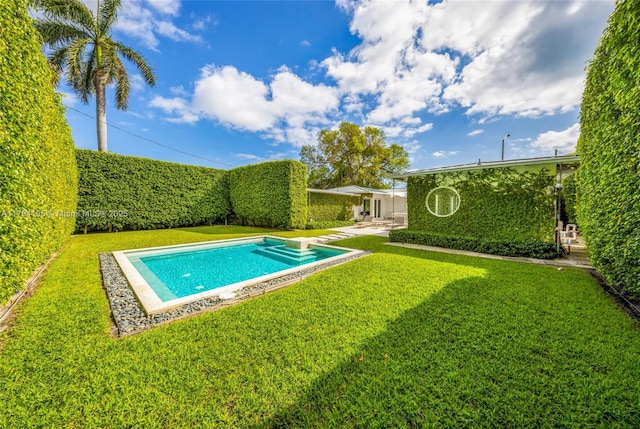 view of swimming pool featuring a fenced in pool and a yard