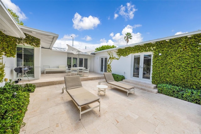 view of patio featuring french doors