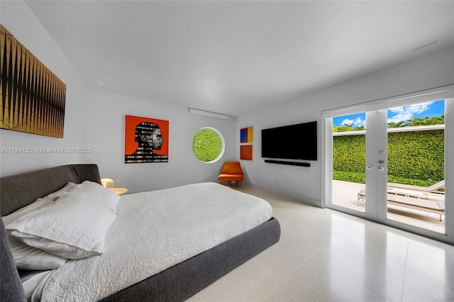 bedroom featuring speckled floor, access to exterior, and french doors