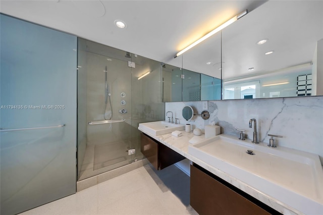 full bathroom featuring a sink, tile patterned flooring, double vanity, recessed lighting, and a stall shower