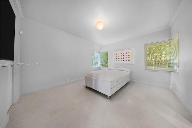 bedroom featuring crown molding and baseboards
