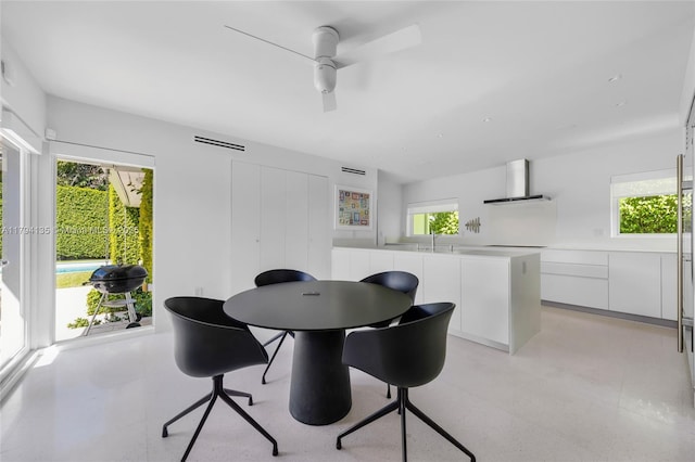 dining space featuring a ceiling fan