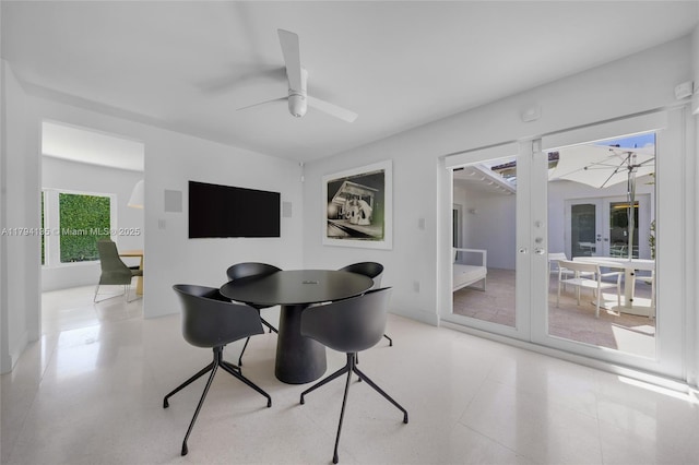 dining room with ceiling fan and french doors