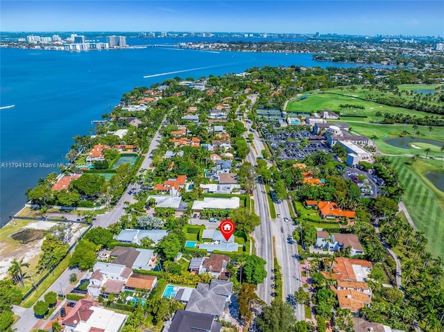 aerial view with a residential view, a water view, and golf course view