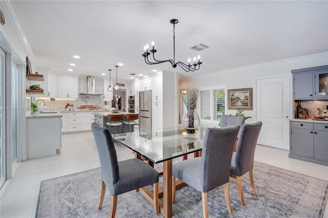 dining space with an inviting chandelier, ornamental molding, light tile patterned floors, and visible vents