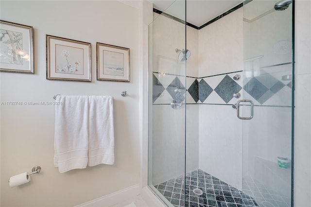 bathroom with a shower stall