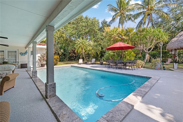 outdoor pool featuring a patio and outdoor dining space