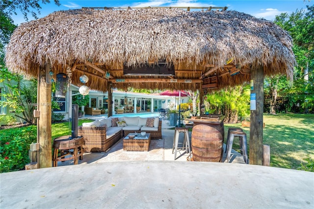 view of patio / terrace with a gazebo, an outdoor hangout area, and ceiling fan