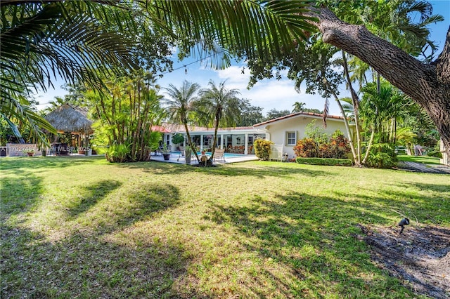 view of yard featuring a patio and an outdoor pool