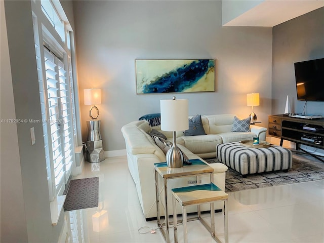 450 N Federal Hwy Unit 102, Boynton Beach, FL 33435 - living room featuring baseboards and tile patterned floors