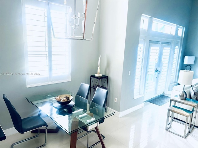 450 N Federal Hwy Unit 102, Boynton Beach, FL 33435 - dining room featuring plenty of natural light and baseboards