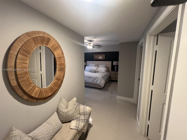 450 N Federal Hwy Unit 102, Boynton Beach, FL 33435 - bedroom with baseboards, a ceiling fan, and tile patterned floors