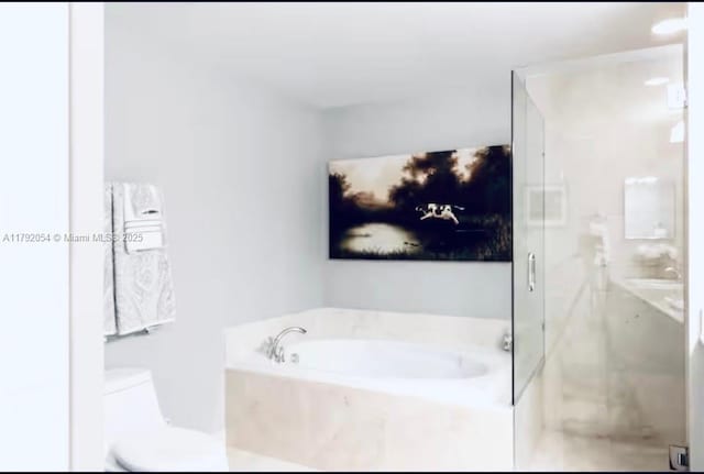 450 N Federal Hwy Unit 102, Boynton Beach, FL 33435 - bathroom with a garden tub, a shower stall, and toilet