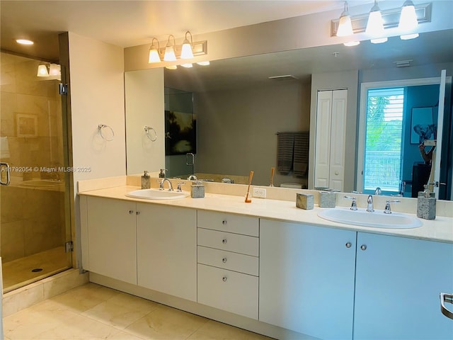450 N Federal Hwy Unit 102, Boynton Beach, FL 33435 - bathroom with a stall shower, double vanity, and tile patterned flooring
