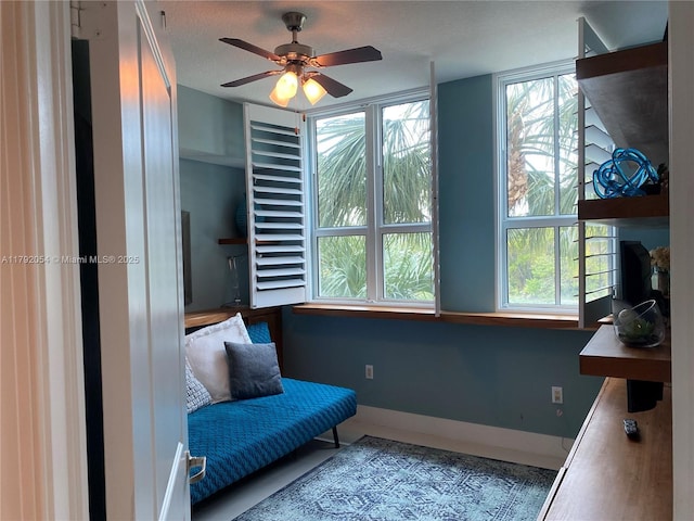 450 N Federal Hwy Unit 102, Boynton Beach, FL 33435 - living area featuring ceiling fan and baseboards