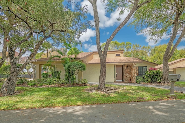 8097 Royal Palm Cir, Tamarac, FL 33321 - view of front of property featuring stucco siding and a front lawn
