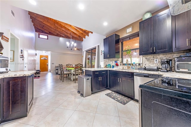 8097 Royal Palm Cir, Tamarac, FL 33321 - kitchen with beam ceiling, light tile patterned flooring, a sink, backsplash, and a notable chandelier