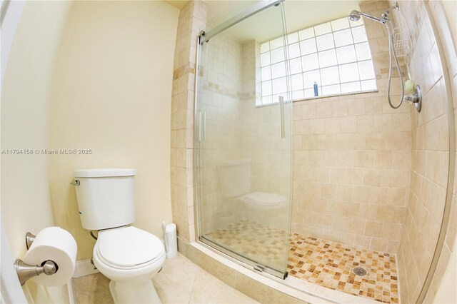 8097 Royal Palm Cir, Tamarac, FL 33321 - full bathroom featuring tile patterned floors, baseboards, a shower stall, and toilet