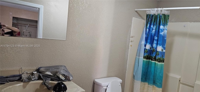 3100-3112 Sanders Rd, Davenport, FL 33837 - full bath with a textured wall, a shower with shower curtain, and toilet