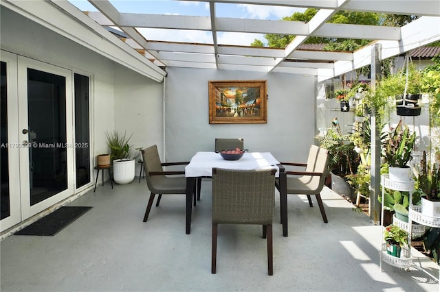 sunroom / solarium with french doors and a skylight