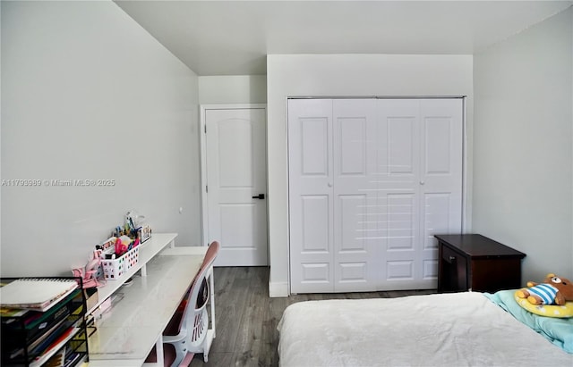 bedroom with a closet and wood finished floors