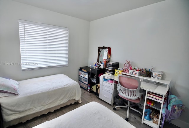 bedroom featuring wood finished floors