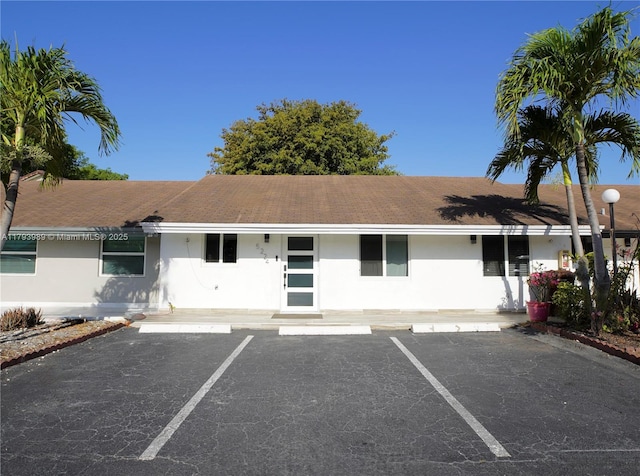 view of property with uncovered parking