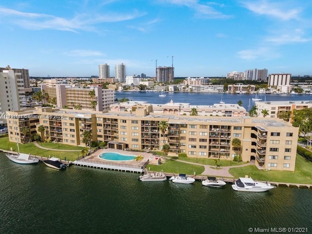 310 Golden Isles Dr Unit 109, Hallandale Beach, FL 33009 - drone / aerial view with a city view and a water view