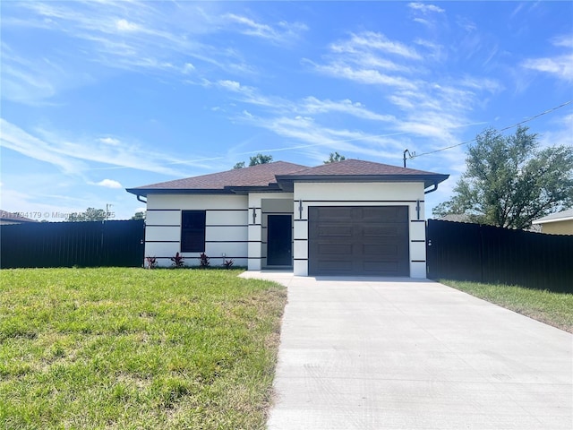 920 E Barton St, Lehigh Acres, FL 33974 - view of front of home with driveway and a garage