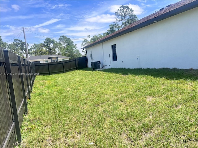 920 E Barton St, Lehigh Acres, FL 33974 - view of yard featuring central air condition unit